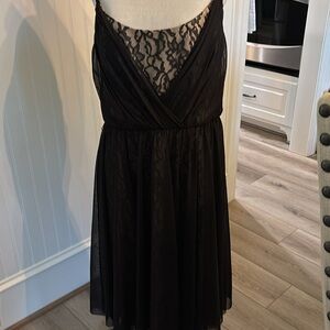 Elegant Black Lace over nude lined Dress